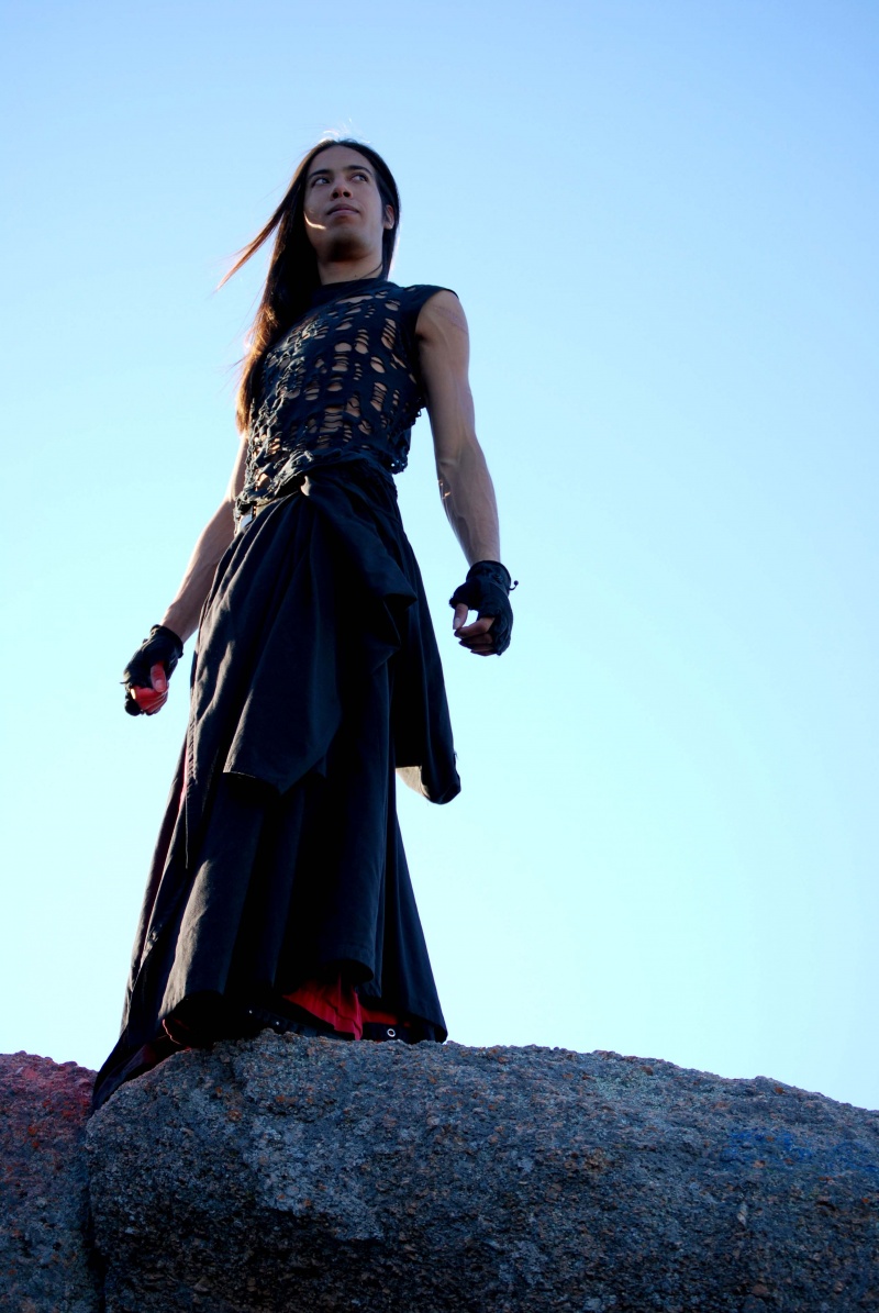 Male model photo shoot of Rayne Tripstar by KimberVillarreal in on top Enchanted Rock