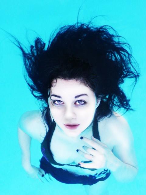 Female model photo shoot of redruM Raven by Noctem Photography in Breckenridge Heights Pool