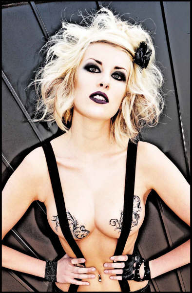 Female model photo shoot of Make Monsters Not War in las vegas house for sale