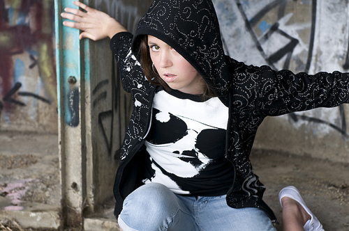 Female model photo shoot of Christy1 in graffiti wall