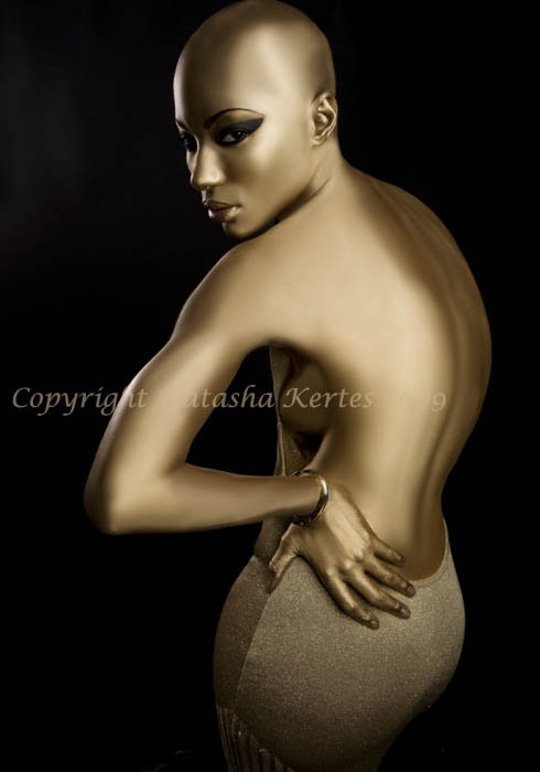 Female model photo shoot of Tco by natasha kertes, makeup by Taryll Atkins