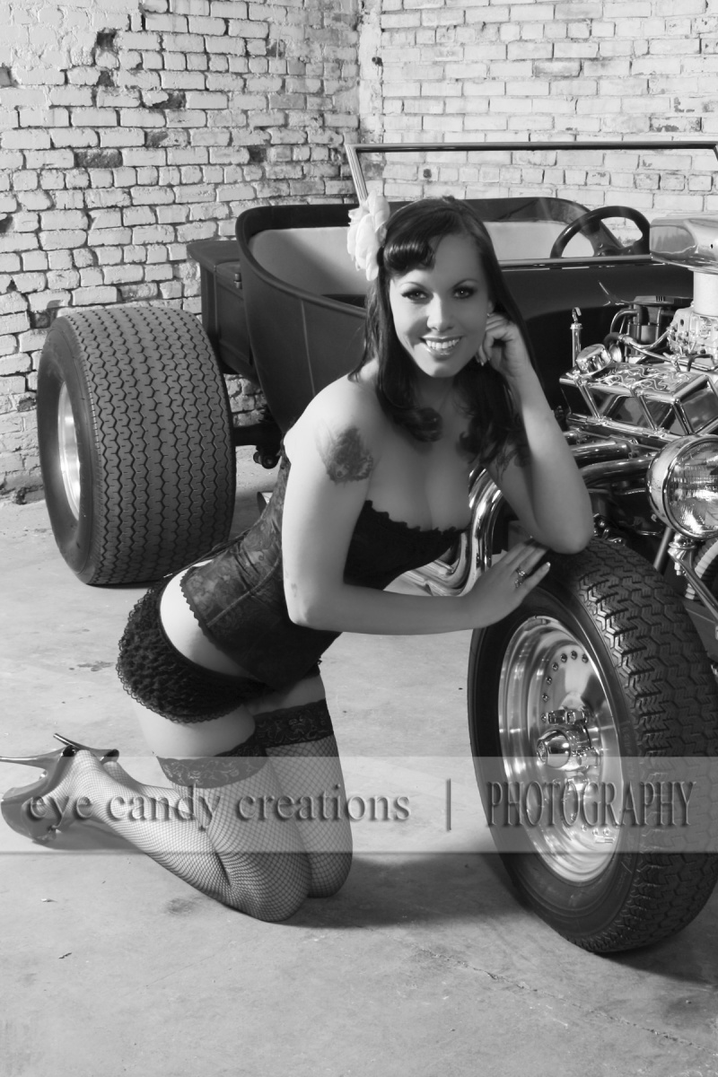 Female model photo shoot of Eye Candy Creations LLC in Outlaw Kustoms Garage, makeup by Mistress of Makeup