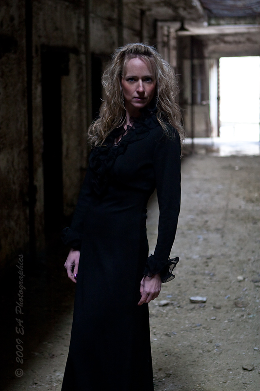 Female model photo shoot of Lynn Louise by EA Photographics in Eastern State Penitentiary