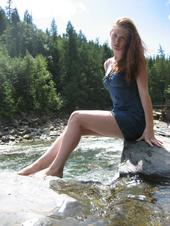 Female model photo shoot of Kaitlyn A in Glacier National Park, Montana