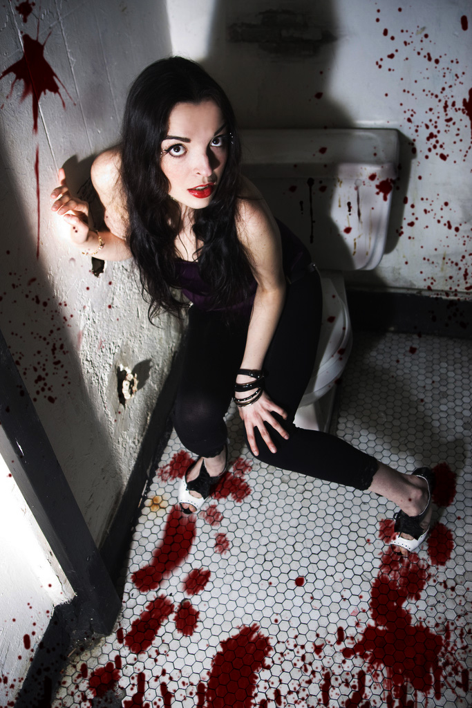Female model photo shoot of mauvaise by Jason Artiga in Toilet hiding, makeup by Raquel Leon