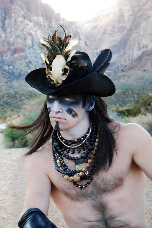 Male model photo shoot of benson has a camera and -Markhollan Swientek- in Red Rock Canyon, Nevada, clothing designed by Atelier Benson 