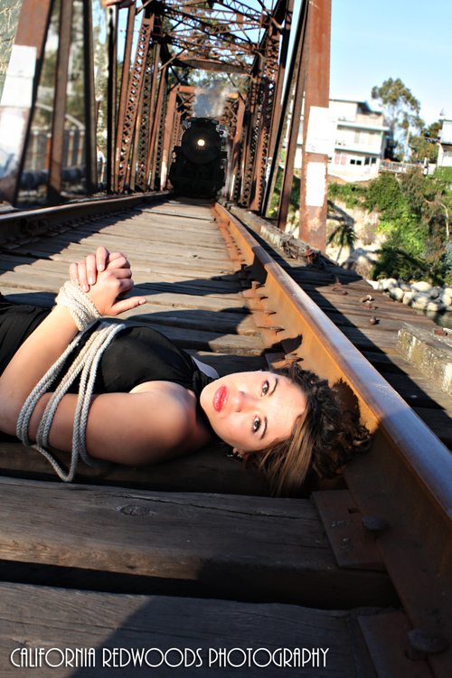 Male and Female model photo shoot of California Redwoods and Luna Del Fuego in On the railroad tracks