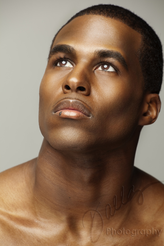 Male model photo shoot of T C Thornton by Dallas J. Logan, makeup by Romell Duresseau MUA