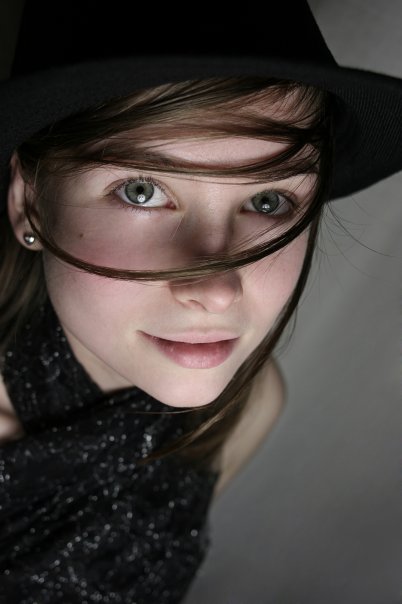 Female model photo shoot of Olja in under a hat 