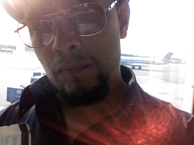 Male model photo shoot of -ART OF SANTIAGO- in Airport via my Mac webcam.