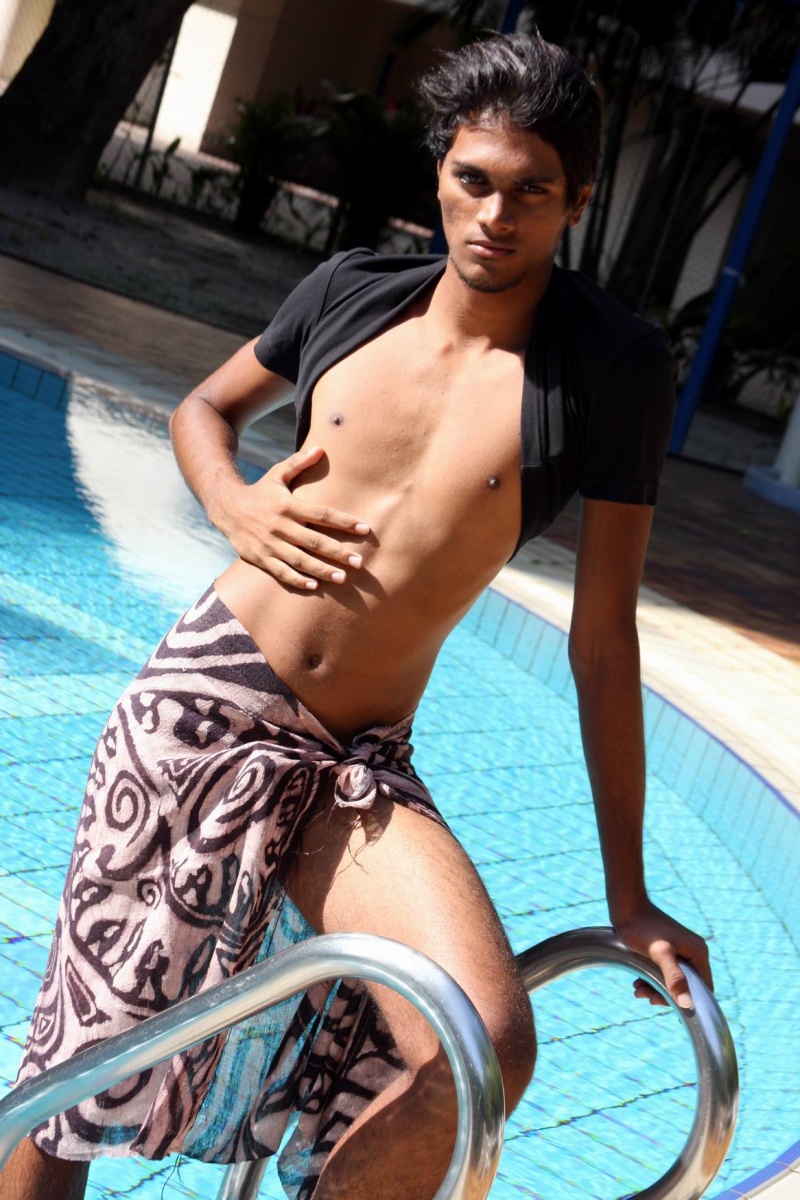 Male model photo shoot of Hariz in by the poolside, clothing designed by Edric Ong Design