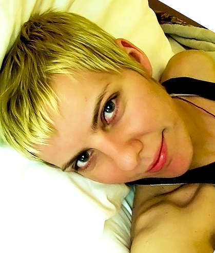 Female model photo shoot of Sunshine Dust in in bed