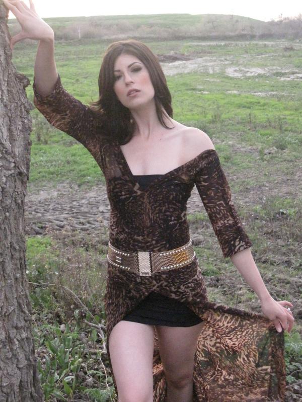Female model photo shoot of KaylaNecole in Riverside CA, clothing designed by LandoCouture