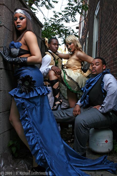 Male and Female model photo shoot of RM67 FASHION INC, - MK -, ElizaMaria and Tomme by Michael Letterlough Jr in THE COUTURE ALLEYWAY, clothing designed by RM67 FASHION INC