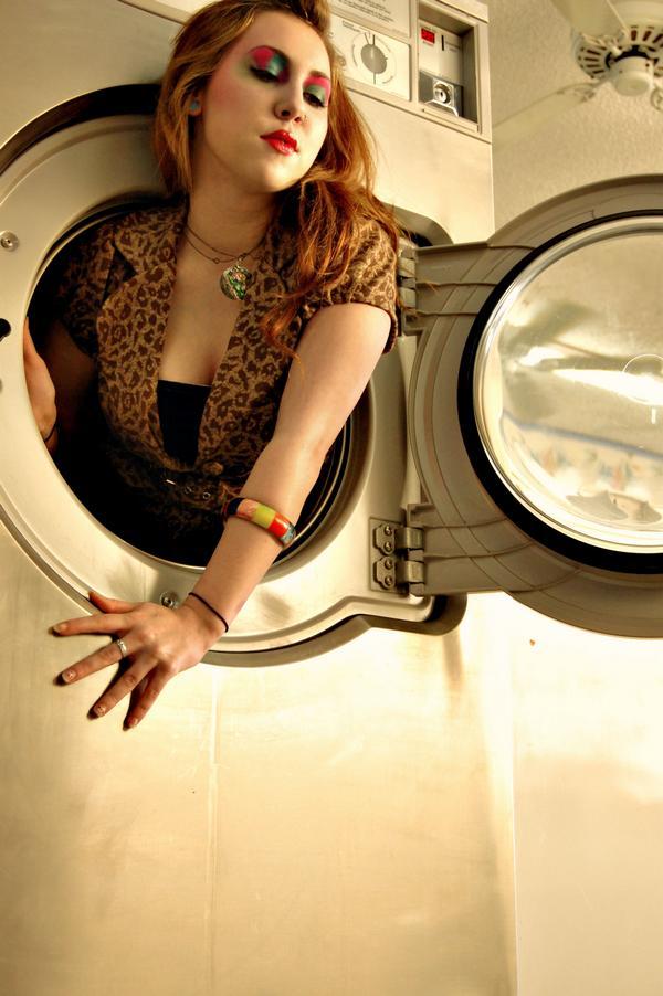 Female model photo shoot of skeloise in laundry matt behind kayla's place