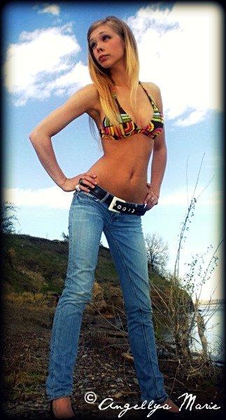 Female model photo shoot of Angellya Marie in Missouri River shoreline