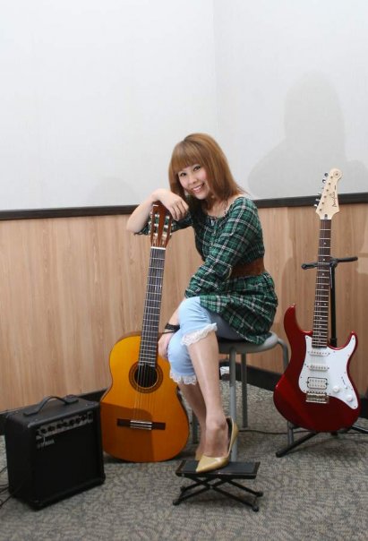 Female model photo shoot of xiaxia in Yamaha Music school