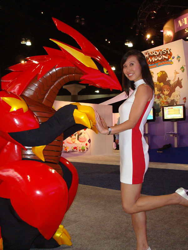 Female model photo shoot of Kali Chung in E3 / Koei Corporation booth