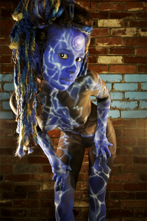 Female model photo shoot of Souly in his house, hair styled by Sisters Of the Moon, body painted by Roustan