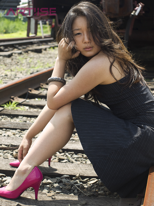 Female model photo shoot of MJeong by ARTIISE PHOTOGRAPHY in train tracks, retouched by Mister ArtIIse