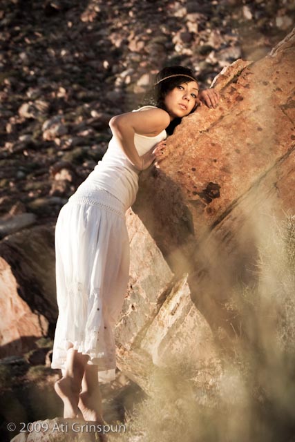 Female model photo shoot of Anais Salazar by Ati Grinspun in red rock, makeup by svaMakeup
