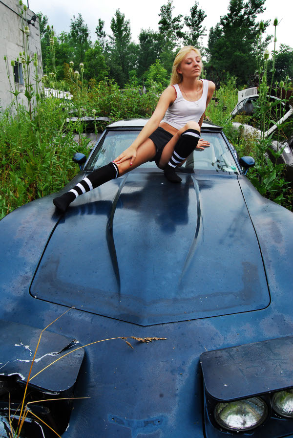 Female model photo shoot of Nikkii Marie in corvette junkyard, webster NY