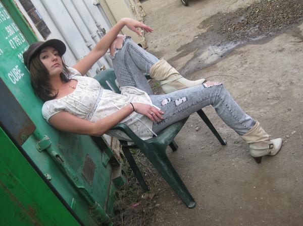 Female model photo shoot of Criket in Dumpster Palace