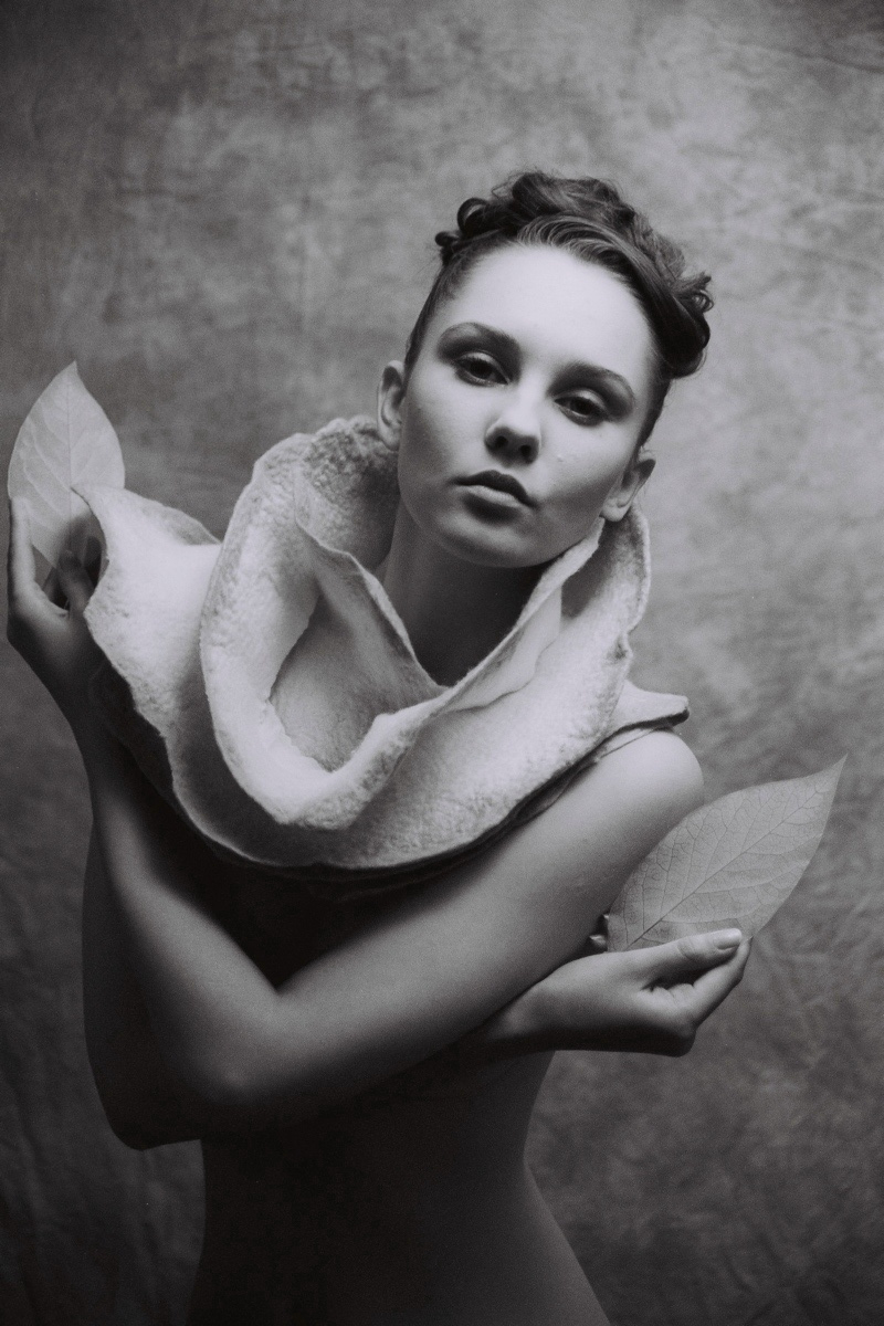 Female model photo shoot of AnyaS by Polymath, clothing designed by Harlequin Feltworks