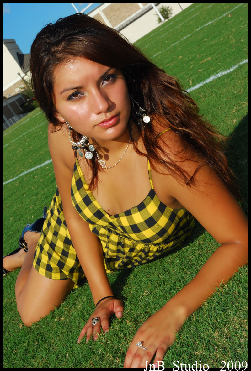 Female model photo shoot of Marsy by Charger Photography in Churchill High Football Field
