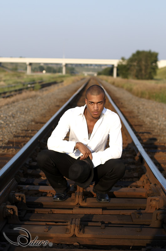 Male model photo shoot of Taylor Duecain in Train yard