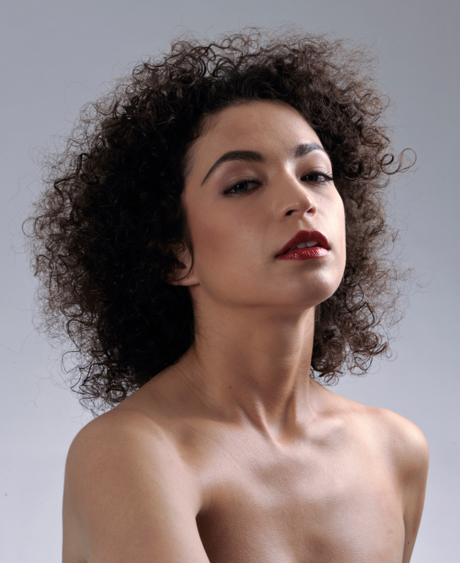 Female model photo shoot of Neshira in Simon Cardwell Studio, makeup by Peenard Piyanath