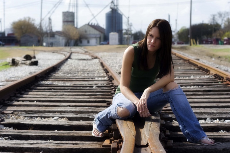 Female model photo shoot of Amy Gilbert in Royse City Train Tracks