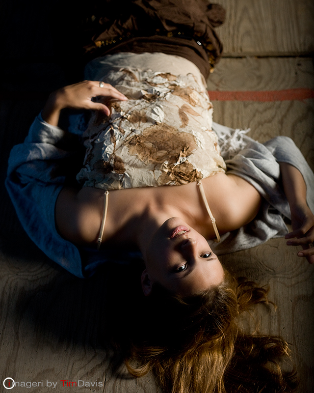 Female model photo shoot of Claya Frances by Imageri by Tim Davis in Casket Arts loading dock
