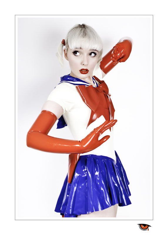 Female model photo shoot of Nimues Latex Fashions and Sophie Roach by Distorted Retina