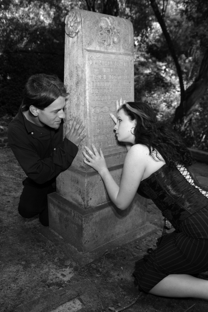 Male and Female model photo shoot of Night Beat Annex and Rocky Xanadu in Evergreen Cemetery, Santa Cruz, California