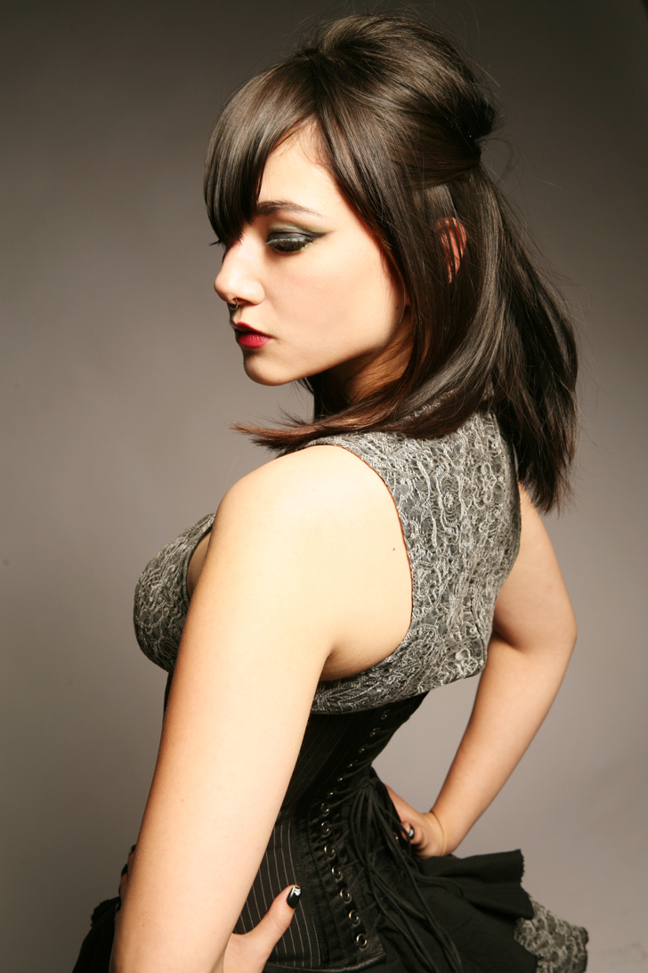 Female model photo shoot of Cyanide Sweetheart by Schneider Studio, hair styled by Janelle Stylist