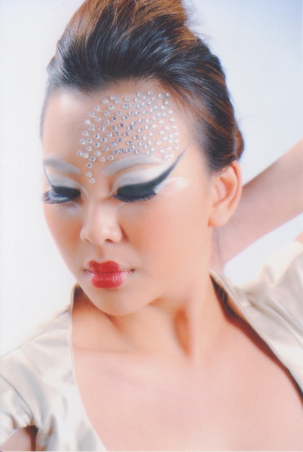 Female model photo shoot of Danelle Loh in Singapore, Cosmoprof International