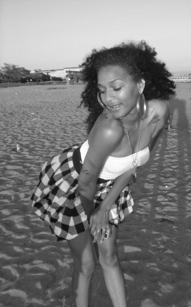 Female model photo shoot of Mazel Nadia Kamara in beach photos