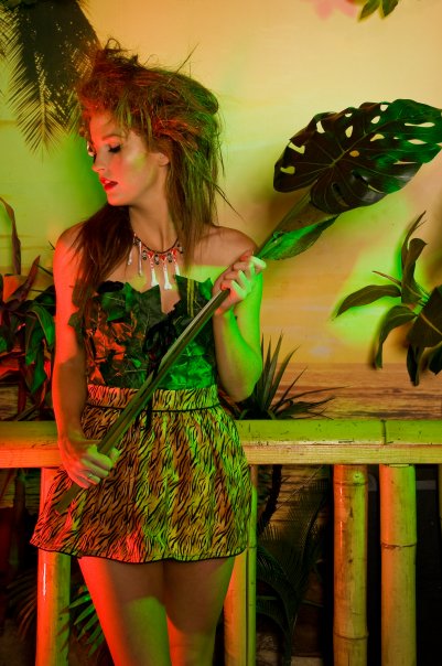 Female model photo shoot of Suzi Homemaker, Dead Corvette and kkkate hedges in Island Paradise, makeup by Claire Bone