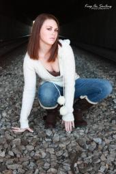 Female model photo shoot of Mariah_Lynn in train tracks under the mobile convention center 