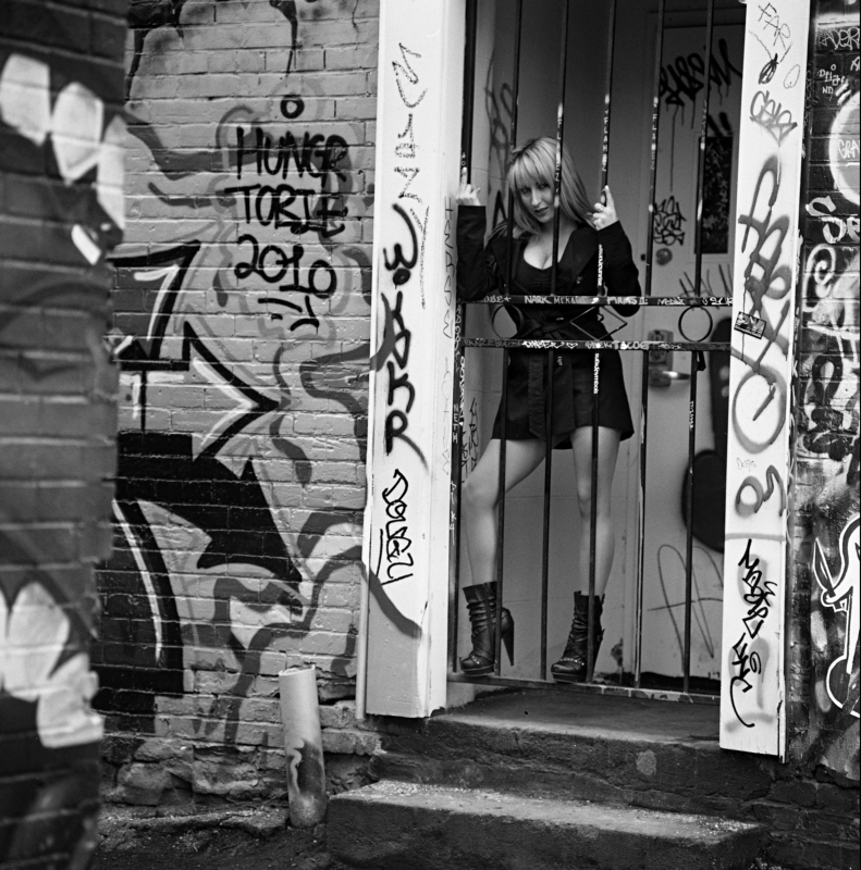 Female model photo shoot of Linzy Bee by Ryan Metrix X in Toronto, ON- Grafitti Alley, hair styled by Wanda MacRae