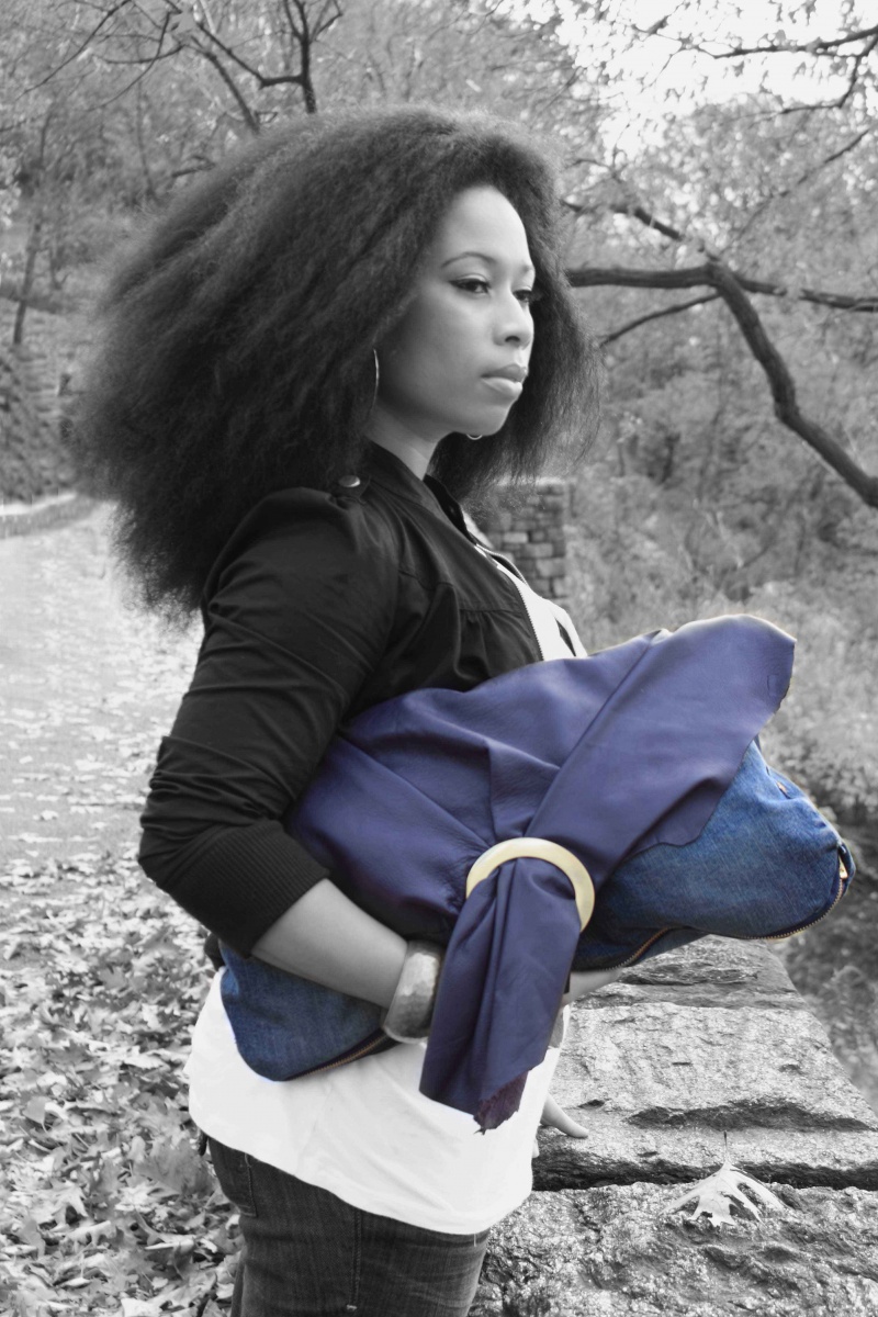 Female model photo shoot of Everette Handbags