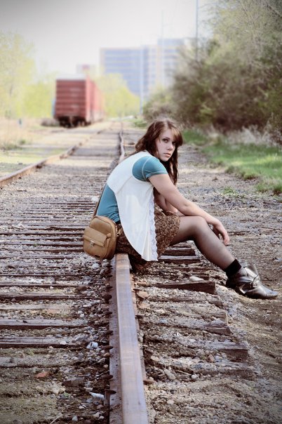 Female model photo shoot of Chersti Rydning in train tracks in Minnesota