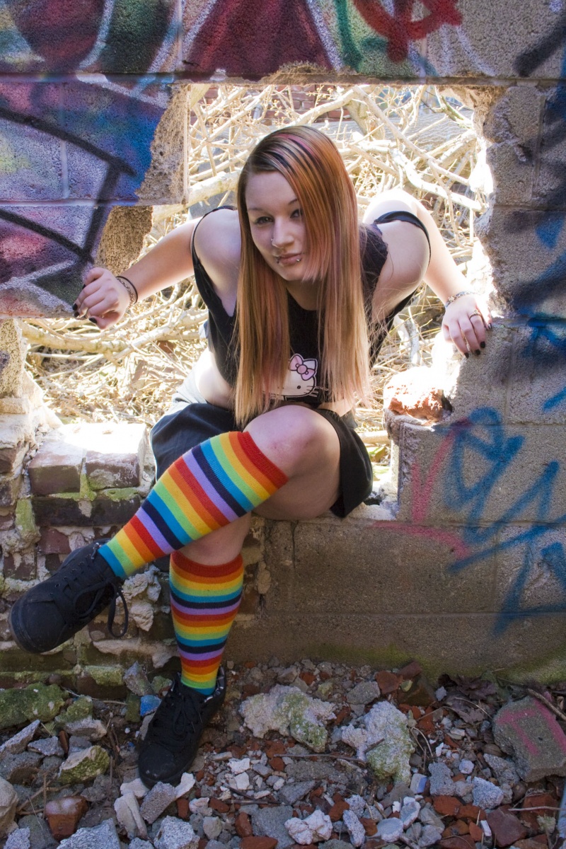 Female model photo shoot of Gir by RudeBoy Photography in Abandoned graffiti building.lol.