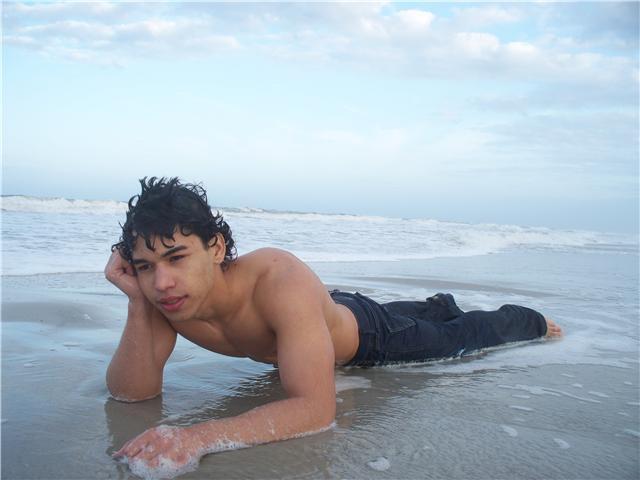 Male model photo shoot of William Gonzalez in on the beach
