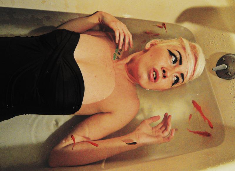 Female model photo shoot of Vmber Doll in bathtub.