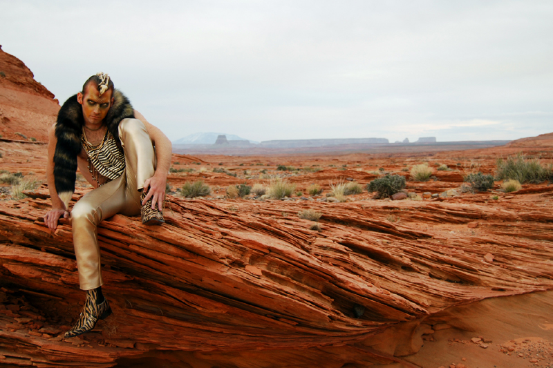 Male model photo shoot of benson has a camera and -Markhollan Swientek- in Navajo Reservation, AZ, clothing designed by Atelier Benson 