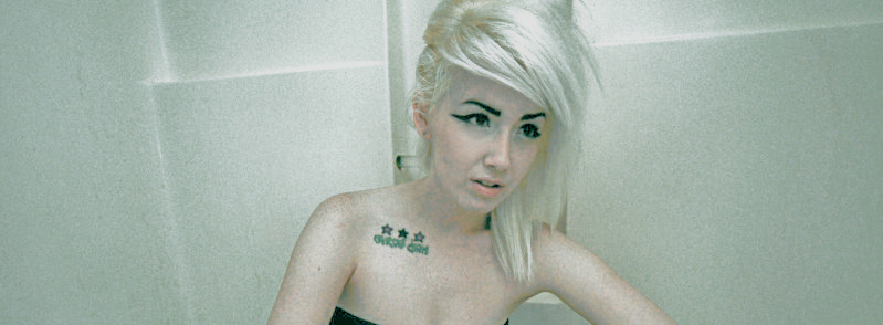 Female model photo shoot of Vmber Doll in bathtub.