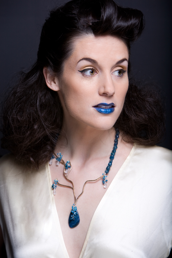 Female model photo shoot of Nora Catherine Jewelry