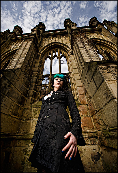 Male and Female model photo shoot of EoL and Mistress Coffin Candy in St Luke's Church, Liverpool